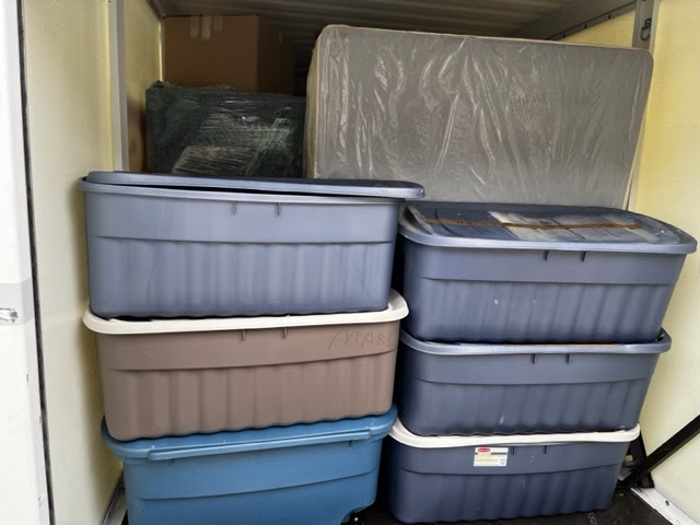 Organized boxes stacked in a van, ready for a seamless relocation with Tera Moving Services.
